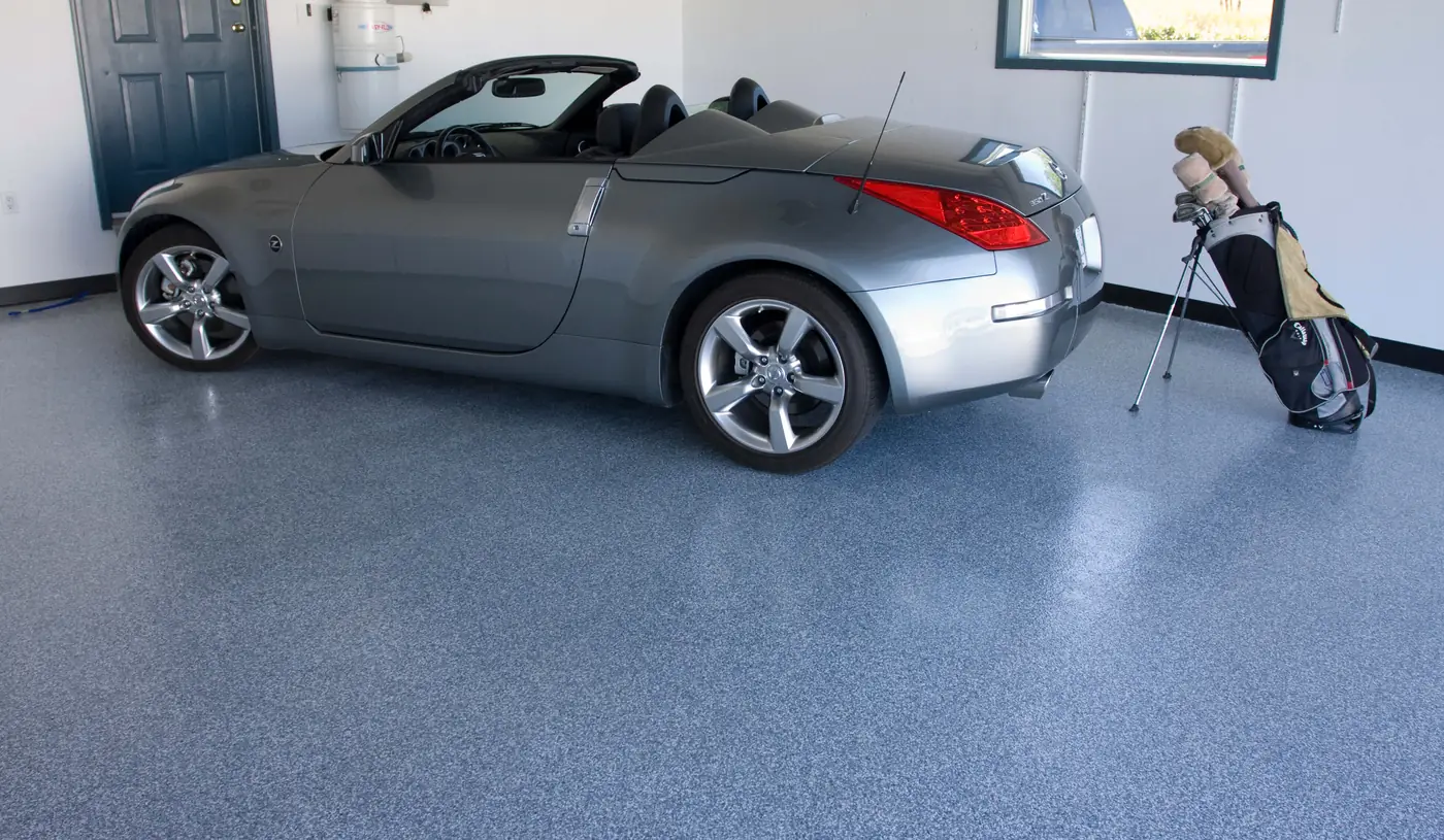 Epoxy flake garage floor with a sports car parked on it