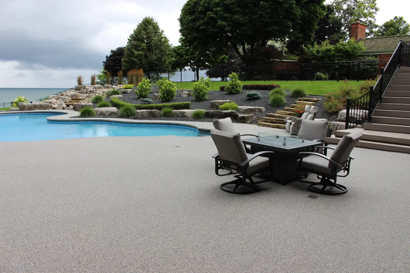 Vuba Stone resin-bound patio and pool surround with outdoor furniture